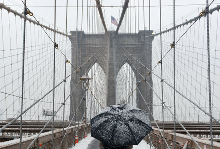 Brooklyn Bridge during a snowstorm in New York City.