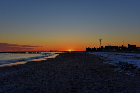 Sunset on Coney Island Beach in the winter.の写真素材