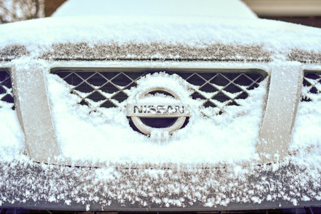 BROOKLYN, NEW YORK - MARCH 1, 2015: Front end of a Nissan pickup truck during a winter storm.のeditorial素材
