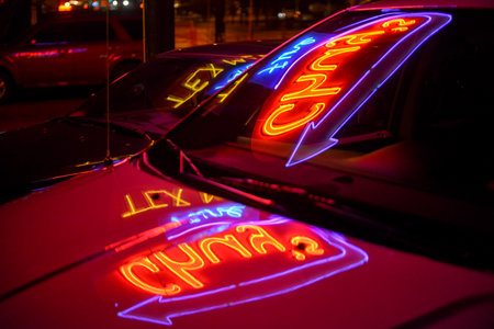 AUSTIN, TX - MARCH 6, 2014: Chuy's, a popular TexMex restaurant in Austin, Texas as reflected on a car during the SXSW Interactive Conference.のeditorial素材