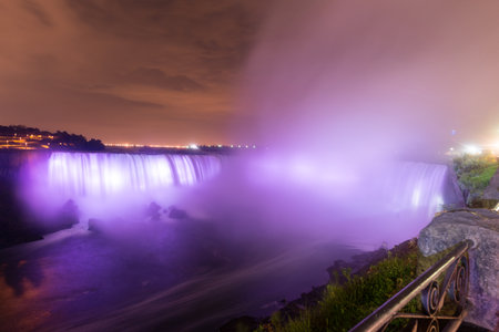 Niagara Falls from Canada at night as it is illuminated.の写真素材