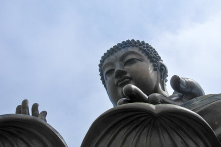 Tian Tan Buddha of Hong Kong shrouded in fog.の写真素材