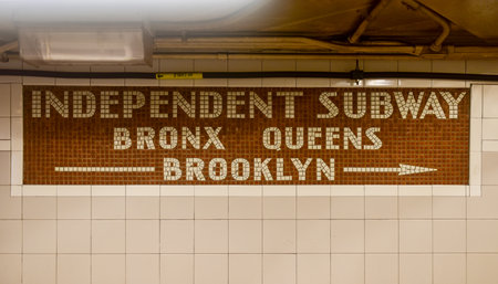 New York City - August 7, 2015: Independent Subway (IND) Mosaic Sign in the 34th Street station of the Sixth Avenue NYC Subway line.のeditorial素材