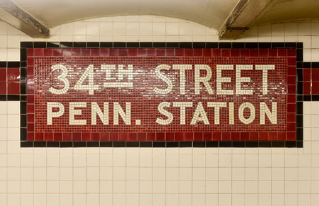 New York City - August 7, 2015: 34th Street Penn. Station New York City Subway sign in the 34th Street station of the Eighth Avenue NYC Subway line.のeditorial素材