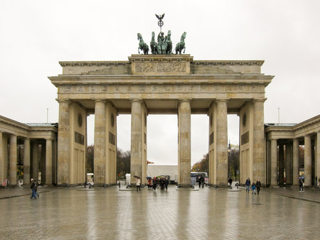 Chariot with the goddess of victory Victoria on the Brandenburg gate, Berlin, Germany, on a cloudy day.のeditorial素材