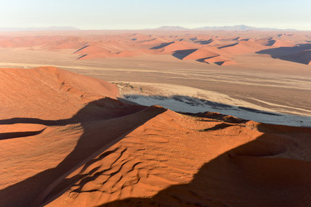 Aerial view of high red dunes, located in the Namib Desert, in the Namib-Naukluft National Park of Namibia.の写真素材