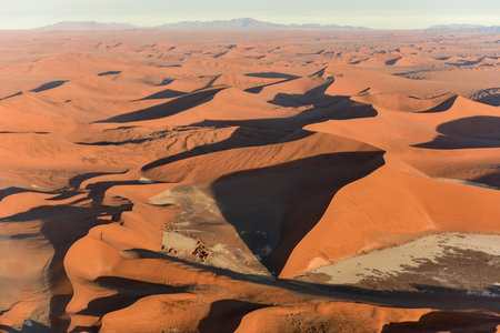 Aerial view of high red dunes, located in the Namib Desert, in the Namib-Naukluft National Park of Namibia.の写真素材