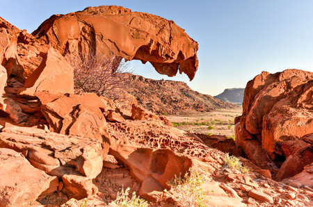 The lion's mouth rock formation throning on top of Huab valley in Twyfelfontein, Namibia.の写真素材