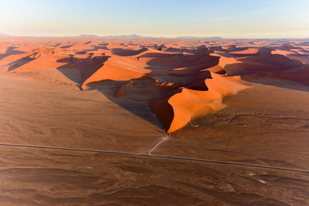 Aerial view of high red dunes, located in the Namib Desert, in the Namib-Naukluft National Park of Namibia.の写真素材