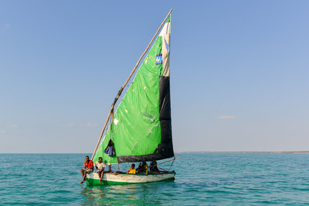 Boys in a sailboat off of Magaruque Island, formerly Ilha Santa Isabel, is part of the Bazaruto Archipelago, off the coast of Mozambique.のeditorial素材