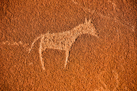 Bushman prehistoric rock engravings at the UNESCO World Heritage Center in Twyfelfontein, Namibia.のeditorial素材
