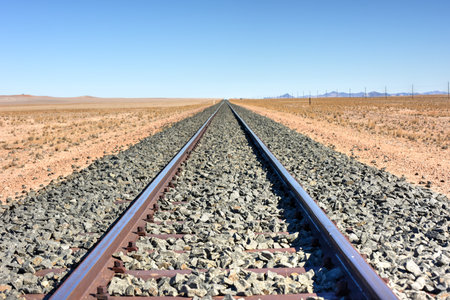 Train tracks in the desert landscape of Namibia.の写真素材