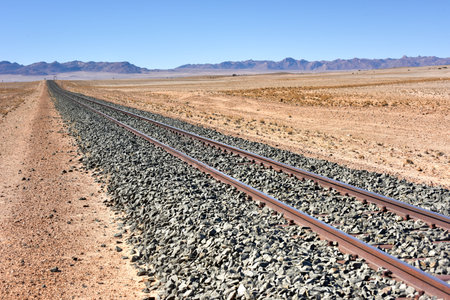 Train tracks in the desert landscape of Namibia.の写真素材