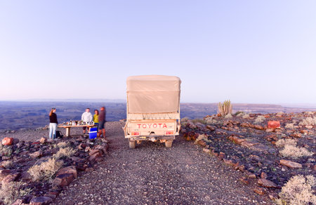 Karas, Namibia - May 10, 2015: Tourists enjoying a sundowner at the Fish River Canyon in Namibia, Africa. It is the largest canyon in Africa.のeditorial素材