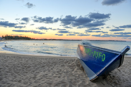 Tofo Beach, Mozambique - July 3, 2012: Fishing boat on Tofo Beach at sunset in Mozambique. Tofo Beach is the dive capital of Mozambique.のeditorial素材
