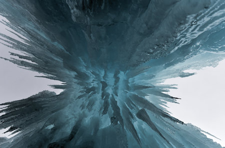 Translucent blue icicles in a frozen ice wall.