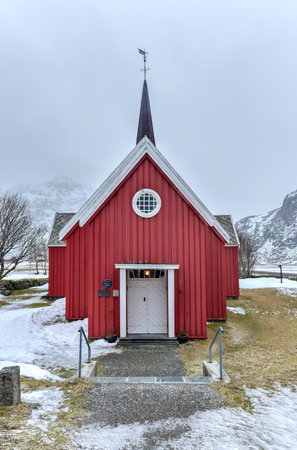 Scenic old red church in Flakstad on Lofoten Islands, Norway in the winter.の写真素材