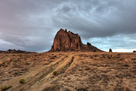 Shiprock is a monadnock rising nearly 1,583 feet above the high-desert plain of the Navajo Nation in San Juan County, New Mexico, United States.の写真素材