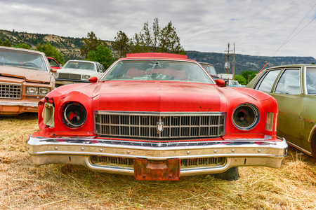 Rusting old car in a desert junk yard.のeditorial素材