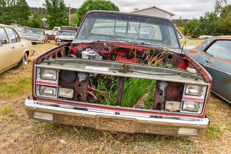 Rusting old car in a desert junk yard.のeditorial素材