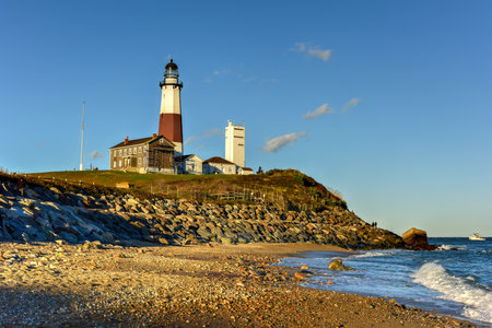 The Montauk Point Lighthouse located adjacent to Montauk Point State Park, at the easternmost point of Long Island, in the hamlet of Montauk in the Town of East Hampton in Suffolk County, New York.の写真素材