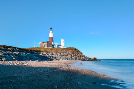The Montauk Point Lighthouse located adjacent to Montauk Point State Park, at the easternmost point of Long Island, in the hamlet of Montauk in the Town of East Hampton in Suffolk County, New York.の写真素材