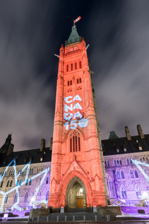 Winter holiday light show projected at night on the Canadian House of Parliament to celebrate the 150th Anniversary of Confederation of Canada in Ottawa, Canada.の写真素材