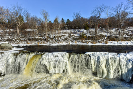 Hog's Back falls located on the Rideau River in Hog's Back park in Ottawa, Ontario Canada frozen over in winter.の写真素材