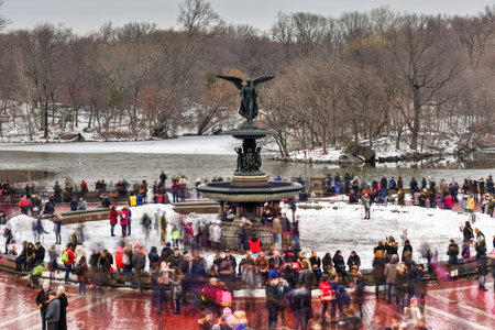 New York City - February 11, 2017: Bethesda Fountain on a winter's day surrounded by tourists in Central Park, New York.のeditorial素材