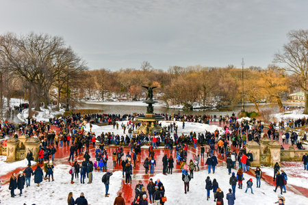New York City - February 11, 2017: Bethesda Fountain on a winter's day surrounded by tourists in Central Park, New York.のeditorial素材
