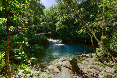 El Nicho Waterfalls in Cuba. El Nicho is located inside the Gran Parque Natural Topes de Collantes, a forested park that extends across the Sierra Escambray mountain range in central Cuba.の写真素材
