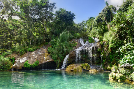 El Nicho Waterfalls in Cuba. El Nicho is located inside the Gran Parque Natural Topes de Collantes, a forested park that extends across the Sierra Escambray mountain range in central Cuba.の写真素材