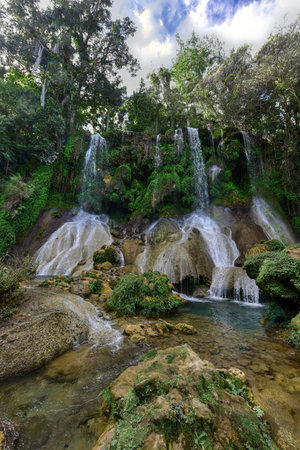 El Nicho Waterfalls in Cuba. El Nicho is located inside the Gran Parque Natural Topes de Collantes, a forested park that extends across the Sierra Escambray mountain range in central Cuba.の写真素材