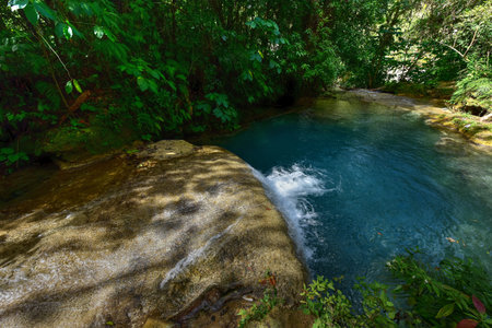 El Nicho Waterfalls in Cuba. El Nicho is located inside the Gran Parque Natural Topes de Collantes, a forested park that extends across the Sierra Escambray mountain range in central Cuba.の写真素材