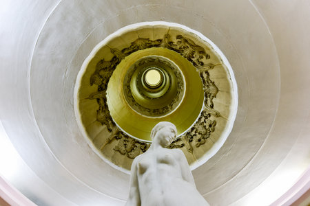 Ornate circular staircase and lobby in an art deco apartment building in the Vedado neighborhood of Havana, Cuba.のeditorial素材