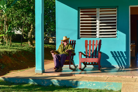 Vinales, Cuba - January 11, 2017: Local cuban man sitting in front of his house in Vinales, Cuba.のeditorial素材
