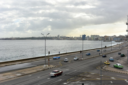 The Malecon (officially Avenida de Maceo) in Havana. It is a broad esplanade, roadway and seawall which stretches for 8 km (5 miles) along the coast in Havana, Cuba.のeditorial素材