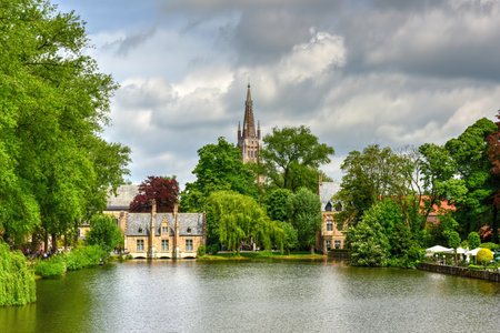 Minnewaterpark and Minnewater lake in the old city of Bruges, Belgium.の写真素材