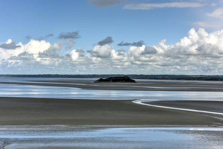 Water around Mont Saint-Michel cathedral on the island, Normandy, Northern France, Europe.の写真素材