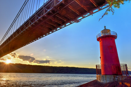 George Washington Bridge and the Red Little Lighthouse in Fort Washington Park, New York, NY in the...