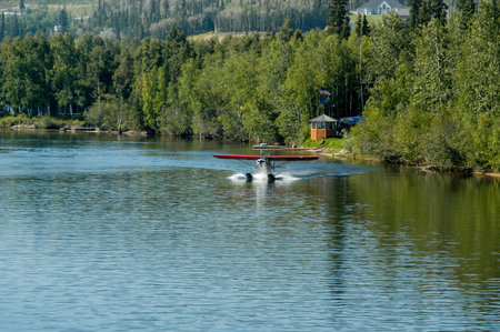 Seaplane landing on the water in Alaska