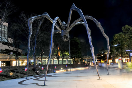 Tokyo, Japan - March 15, 2009: Maman - a spider sculpture by Louise Bourgeois, situated at the base of Mori Tower building in Roppongi Hills at night.のeditorial素材