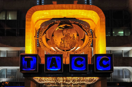 Sign to ITAR-TASS over the entrance to the building at night in Moscow, Russia.のeditorial素材