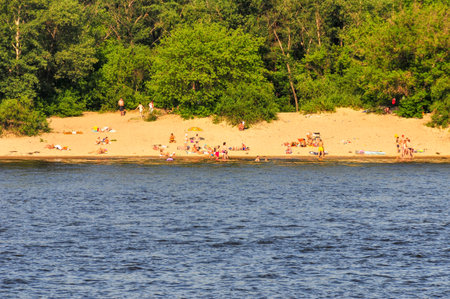 Kiev, Ukraine - June 28, 2009: Sun bathers on the beach in Hydropark in Kiev, Ukraine.のeditorial素材