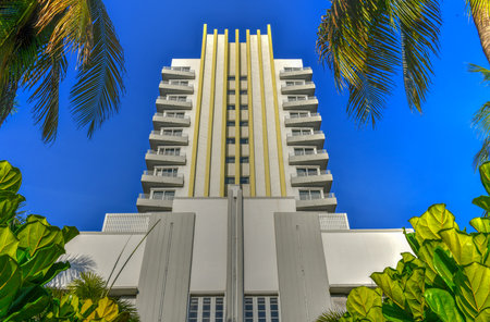 Miami Beach, Florida art deco hotel building surrounded by palm trees.のeditorial素材