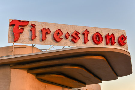 Miami, Florida - April 28, 2018: Vintage Firestone logo on a building. Firestone is an American tire...