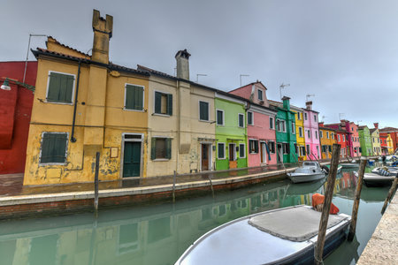 Colorful houses and canals of the island of Burano in Venice, Italy.のeditorial素材