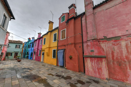 Colorful houses and canals of the island of Burano in Venice, Italy.の写真素材
