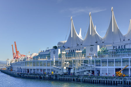 Canada Place and commercial buildings in Downtown Vancouver along Vancouver Harbour.のeditorial素材