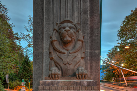 Lion monuments at the entrace to the Lions Gate Bridge in the evening in Vancouver, BC, Canadaのeditorial素材